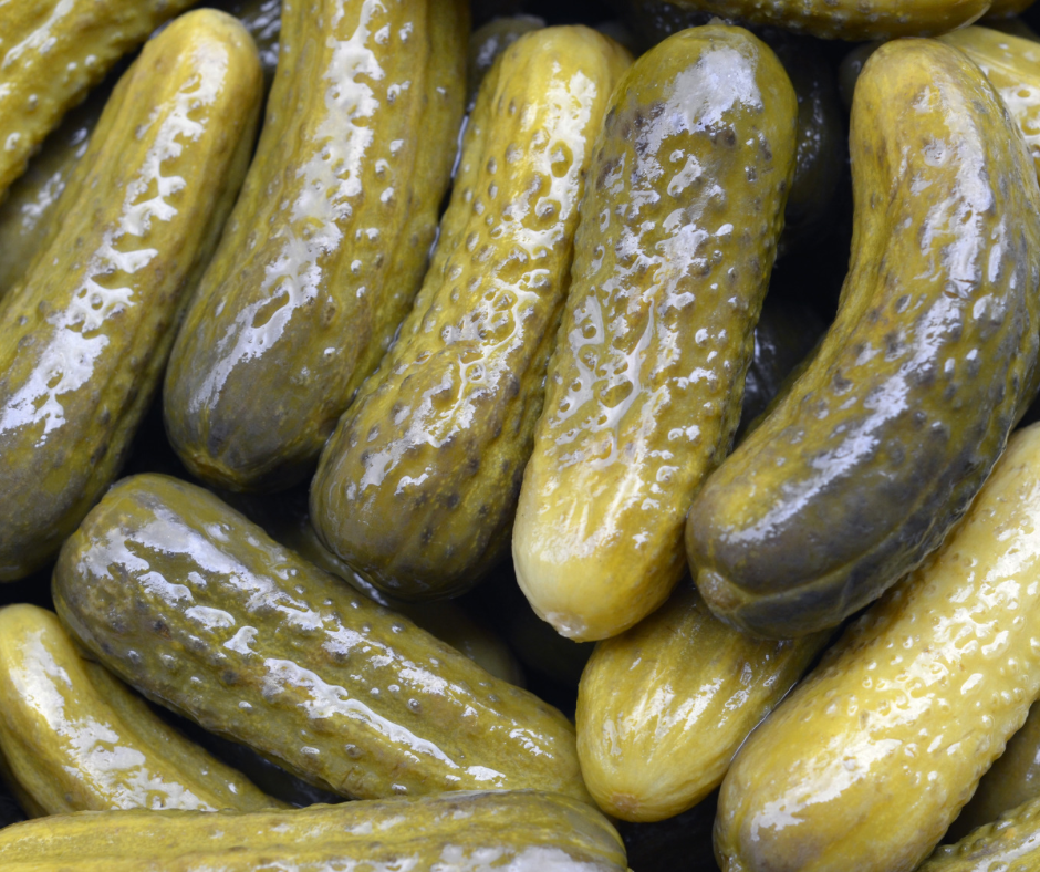 Closeup of dill pickles.