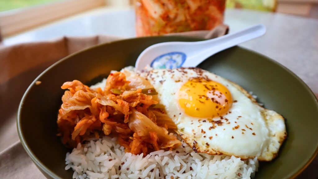 Kimchi for breakfast with rice and egg.