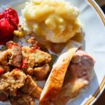 Thanksgiving plate with stuffing, turkey, cranberry and mashed potato